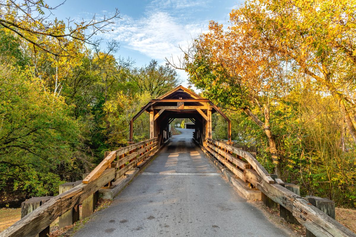 Harrisburg bridge located in Sevier County surrounded by fall foliage.