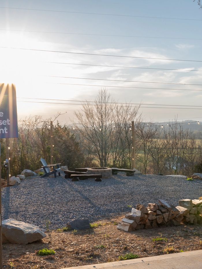 Community firepit at Sunset Point with panoramic Smoky Mountain views at dusk