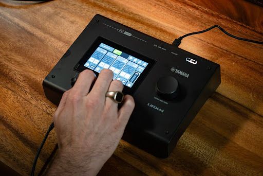 An artist using an Audio interface for music production