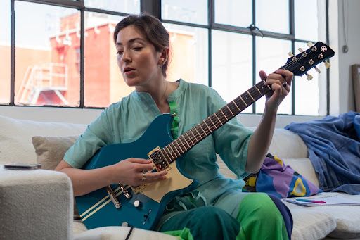 A musician playing an electric guitar 