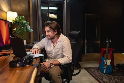  A music producer working on a laptop