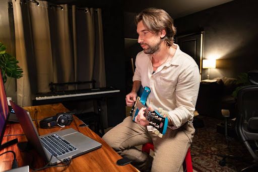 An artist creating music with electric guitar