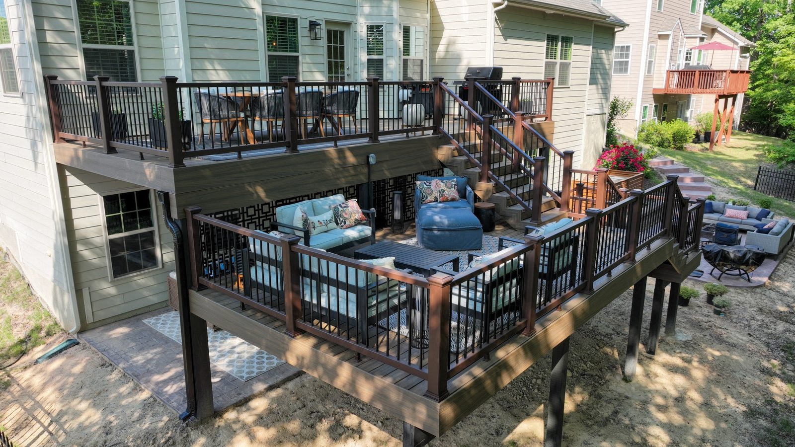 Aerial view of a two-tier deck with pergola and outdoor seating