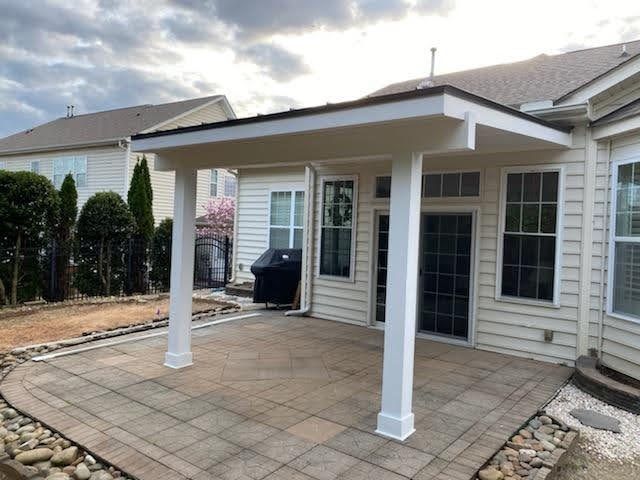 Covered porch with stamped concrete patio