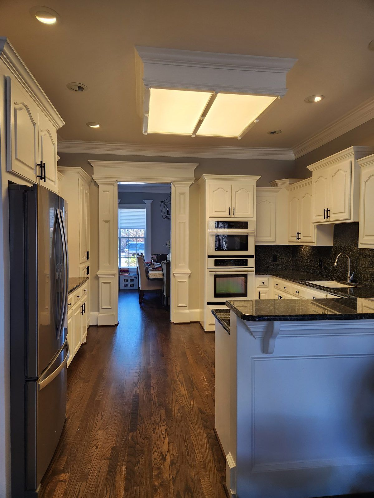 Cream cabinet kitchen with double wall ovens