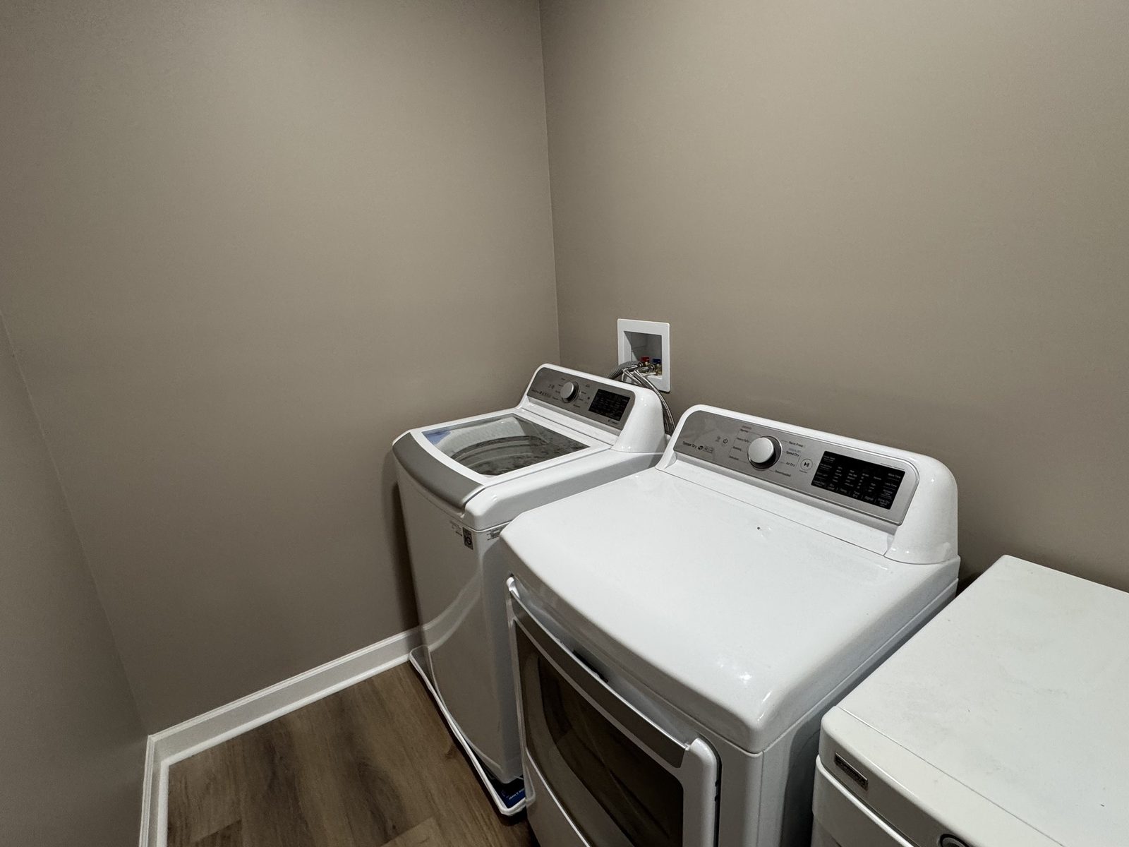 Laundry room with modern washer and dryer