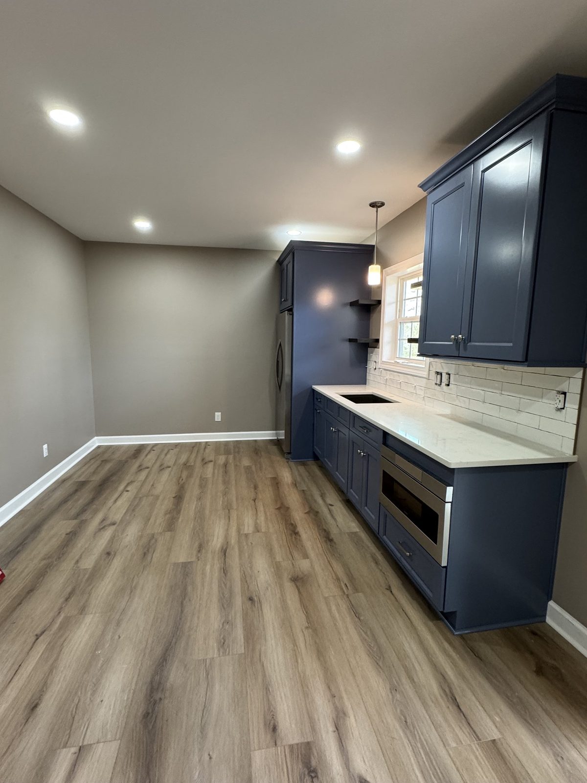 Finished living space with built-in media cabinetry