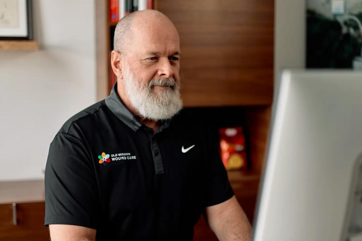 Dr. Christopher Mason at his computer