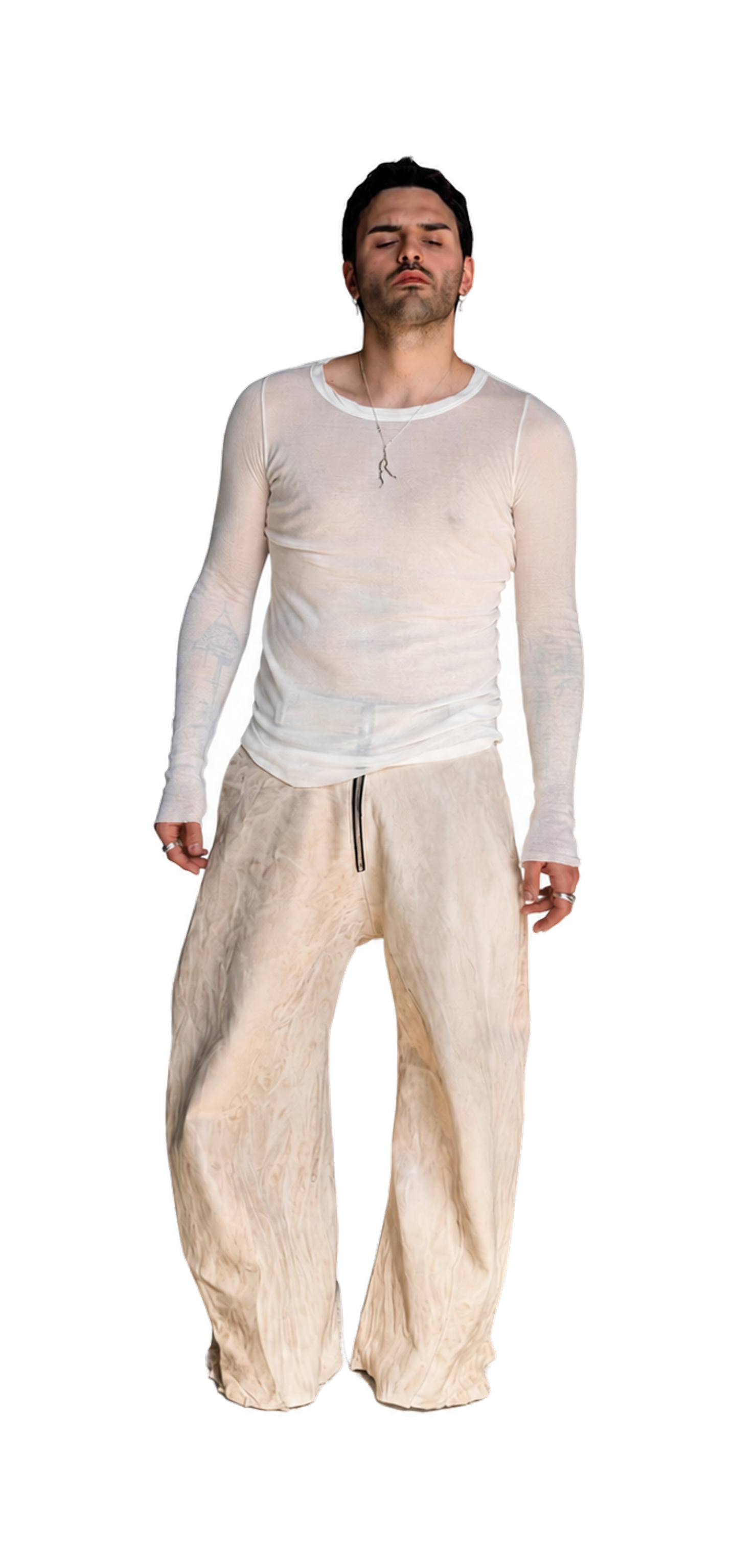 Monumentus Lux, pale trousers and a white mesh top, the piece cut out on pale ground.