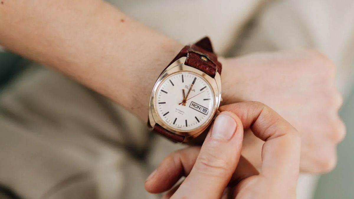 Son wearing his late father's wristwatch as a daily memorial