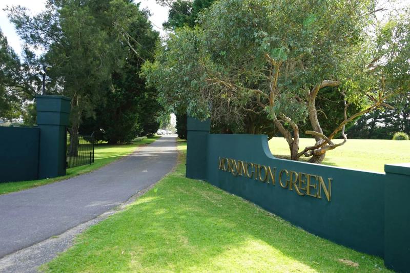 Sunlit memorial trees in the Living Legacy Garden on the Mornington Peninsula.