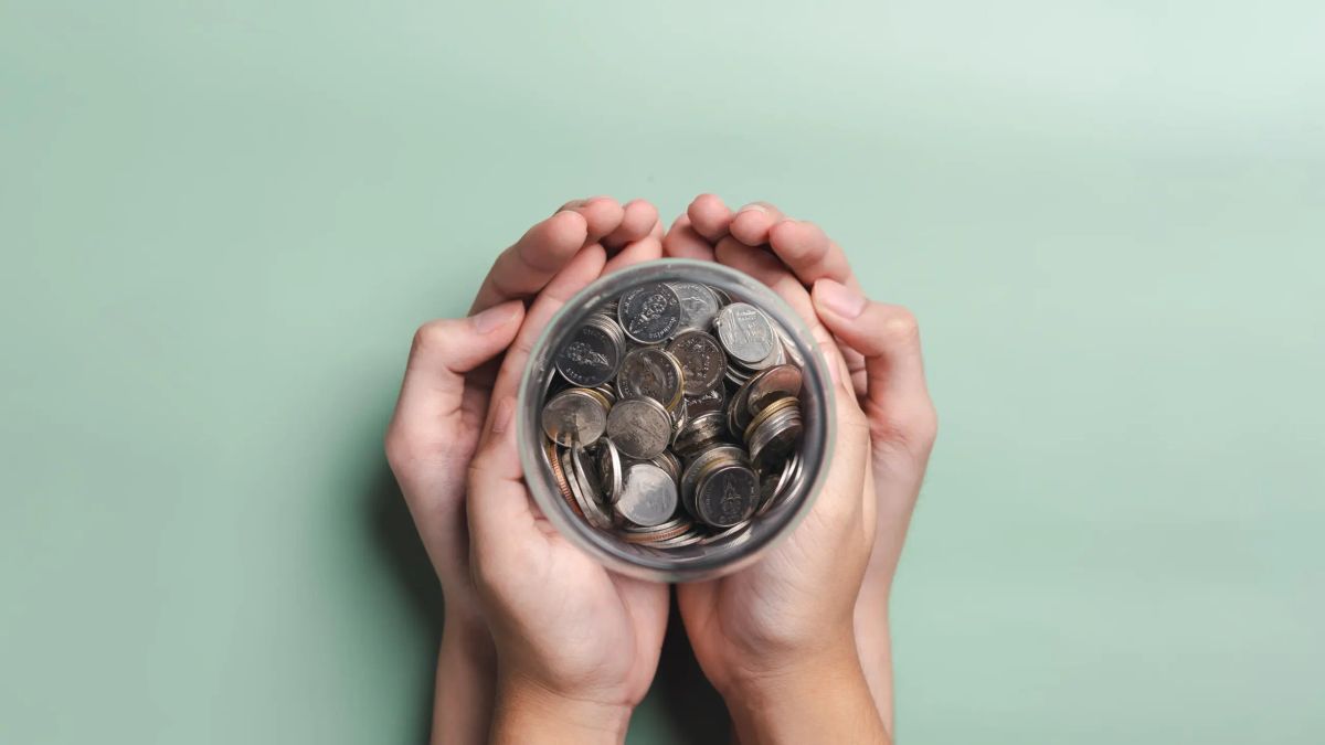 Hands holding savings representing superannuation death benefits after a parent dies in Australia