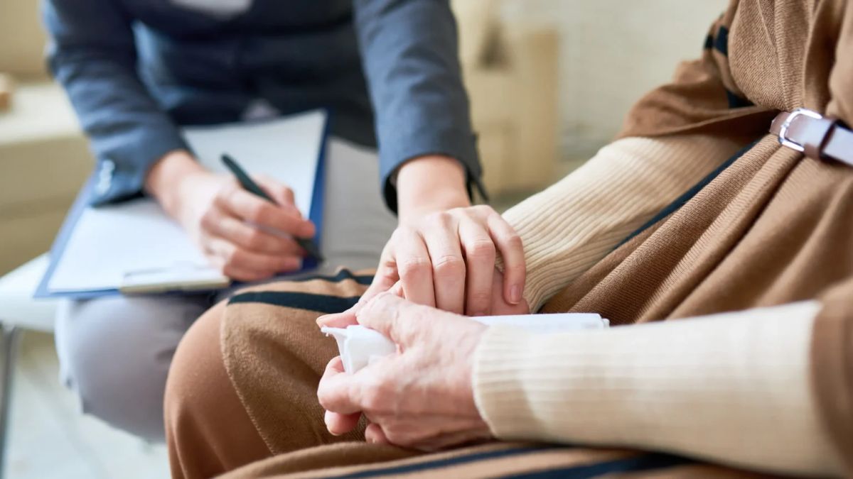 Grief counsellor supporting a client after the loss of a parent