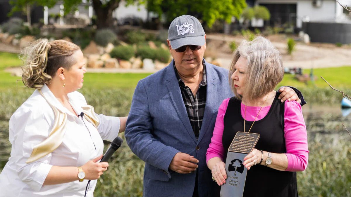 Pet memorial ceremony at Living Legacy Gardens in Mornington Green, with family honoring their beloved pet outdoors.