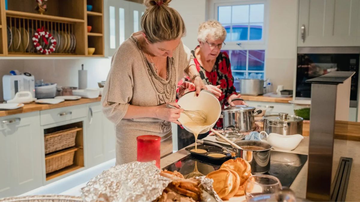 Mother and daughter cooking a family recipe together, honouring a parent's memory