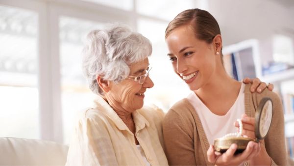 Daughter and mother sharing a keepsake before passing, memorial ideas for parents
