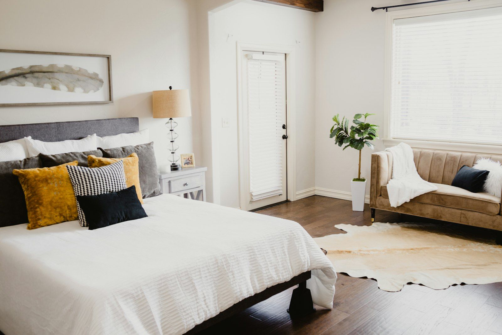 White bed linen near a white door