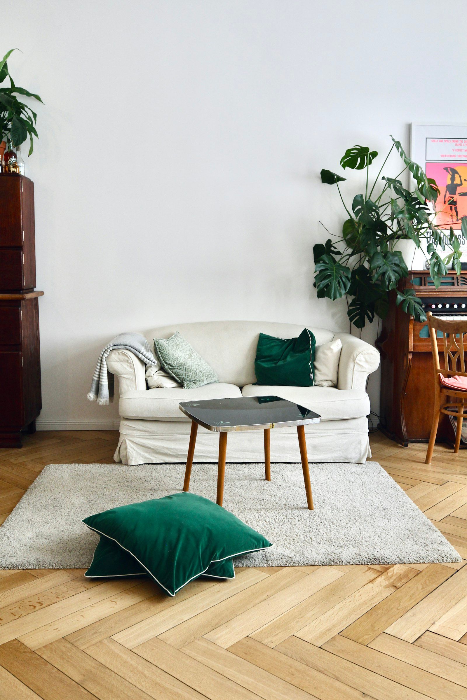 Sofa with green throw pillow