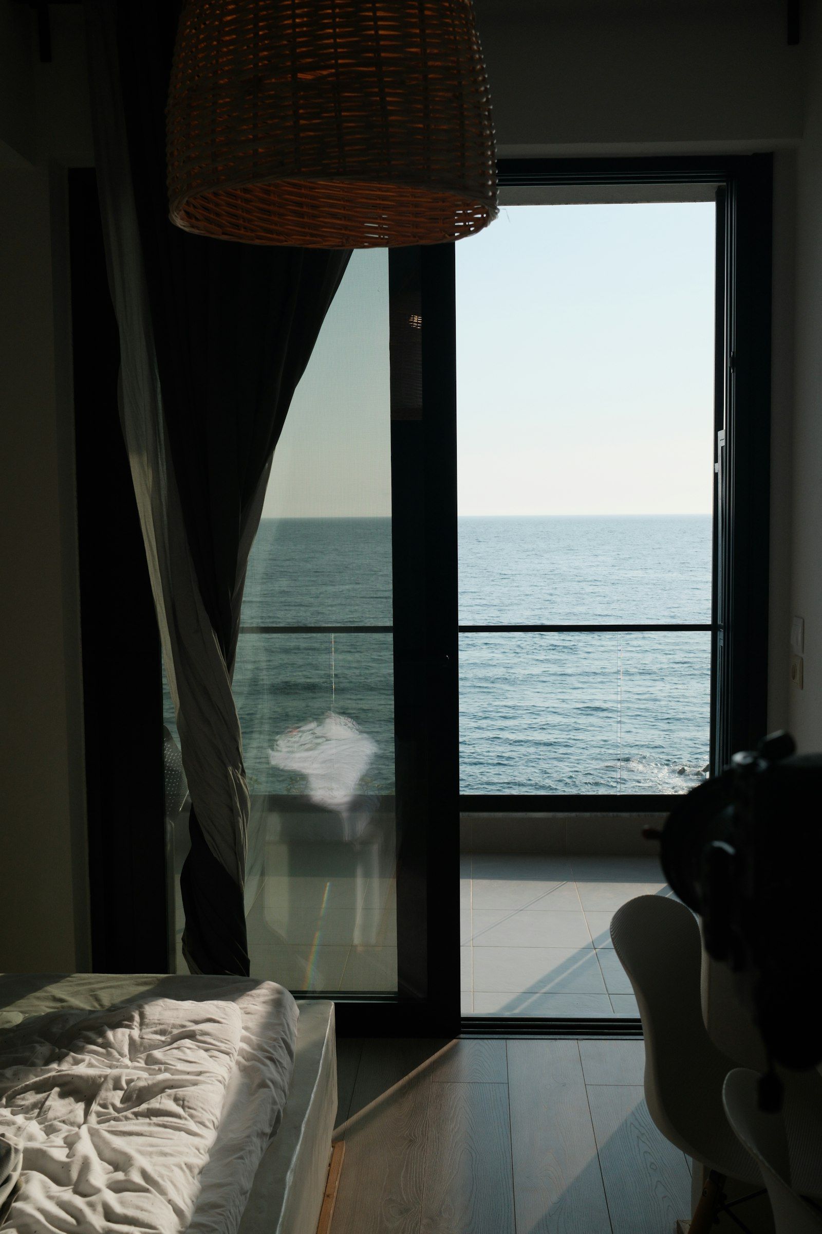 Ocean view from a bedroom with a balcony
