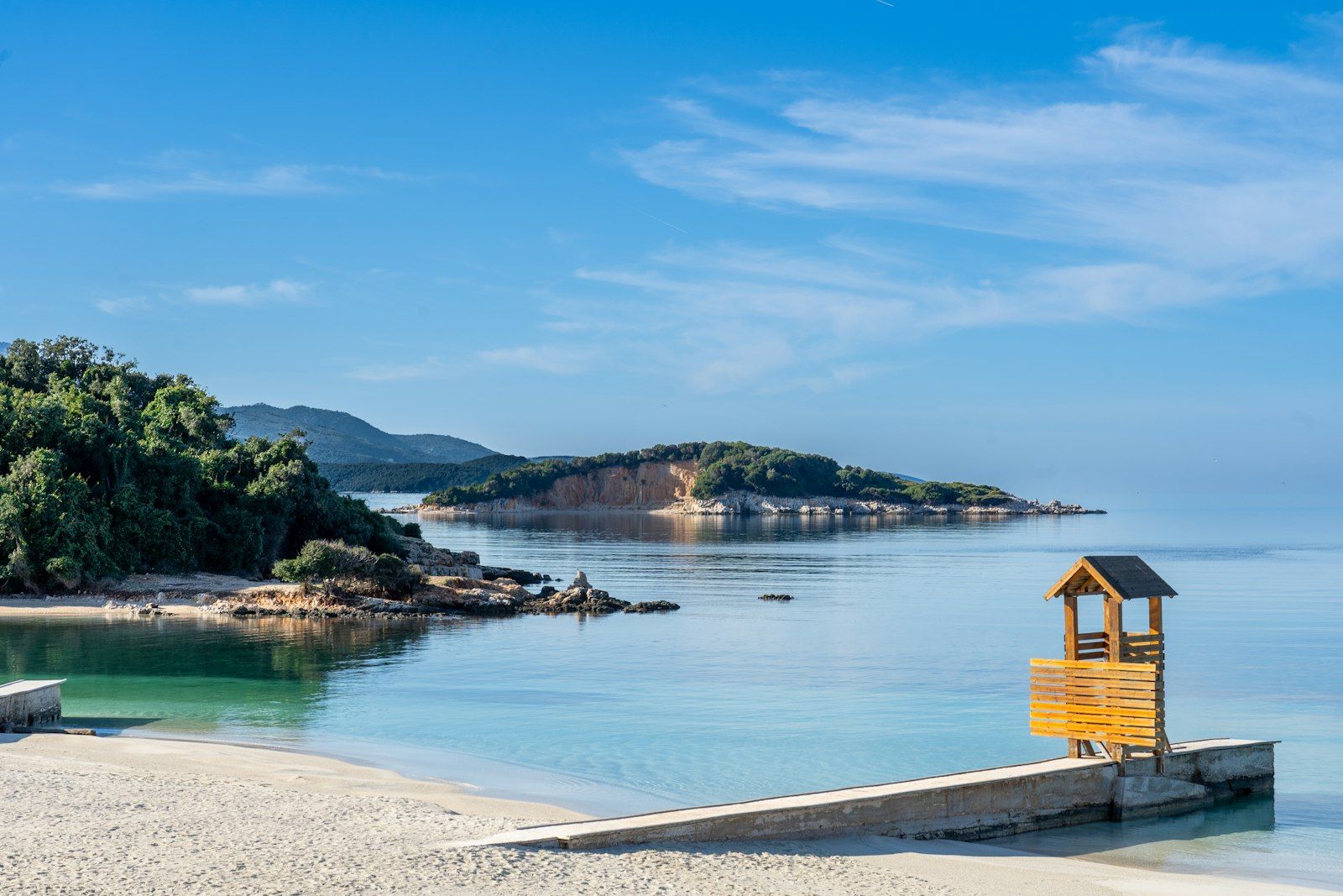 Wooden bench on a sandy beach