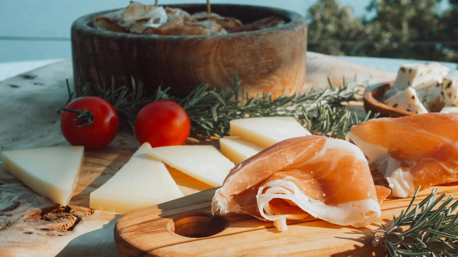 sliced meat on brown wooden chopping board