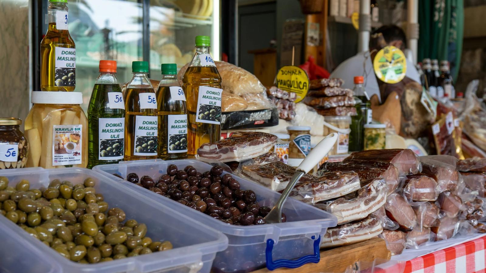 a display of olives, bread, and olive oil