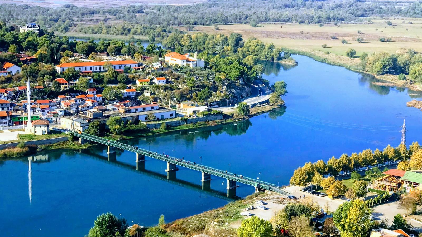 aerial view of city near body of water during daytime