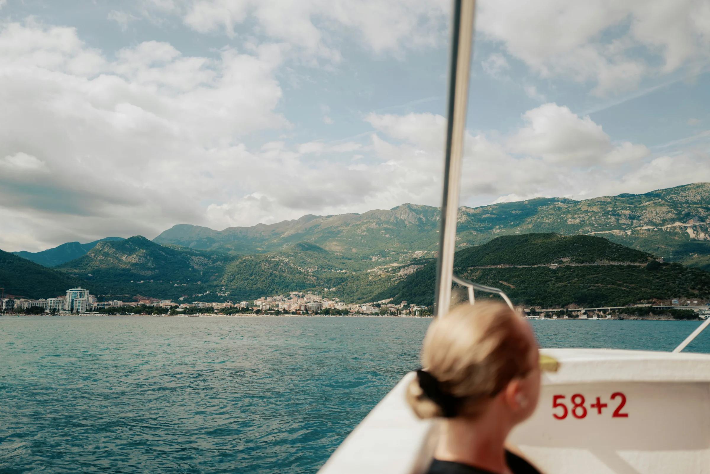 A woman sitting on a boat in the water