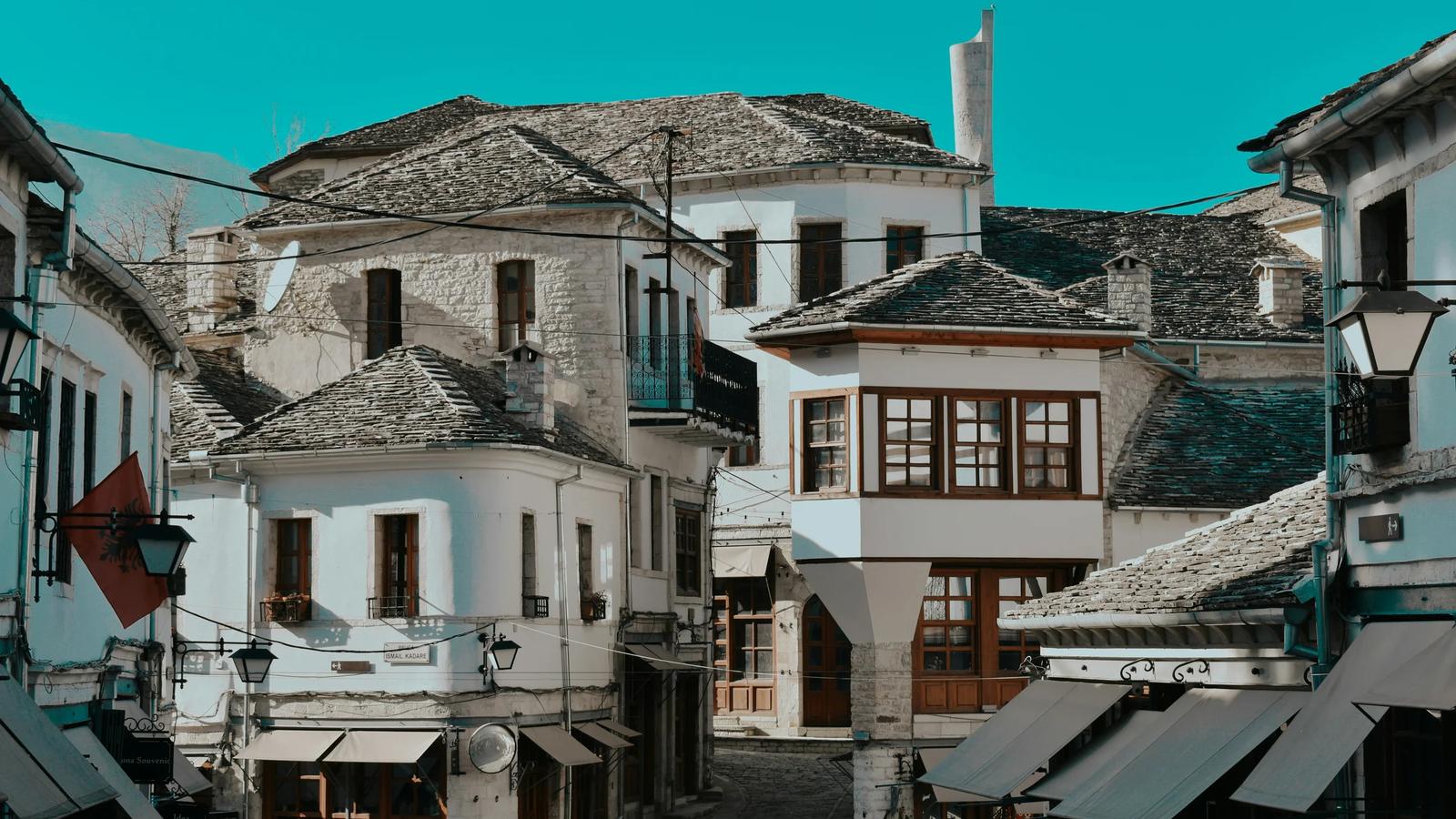 white and brown concrete houses under blue sky during daytime