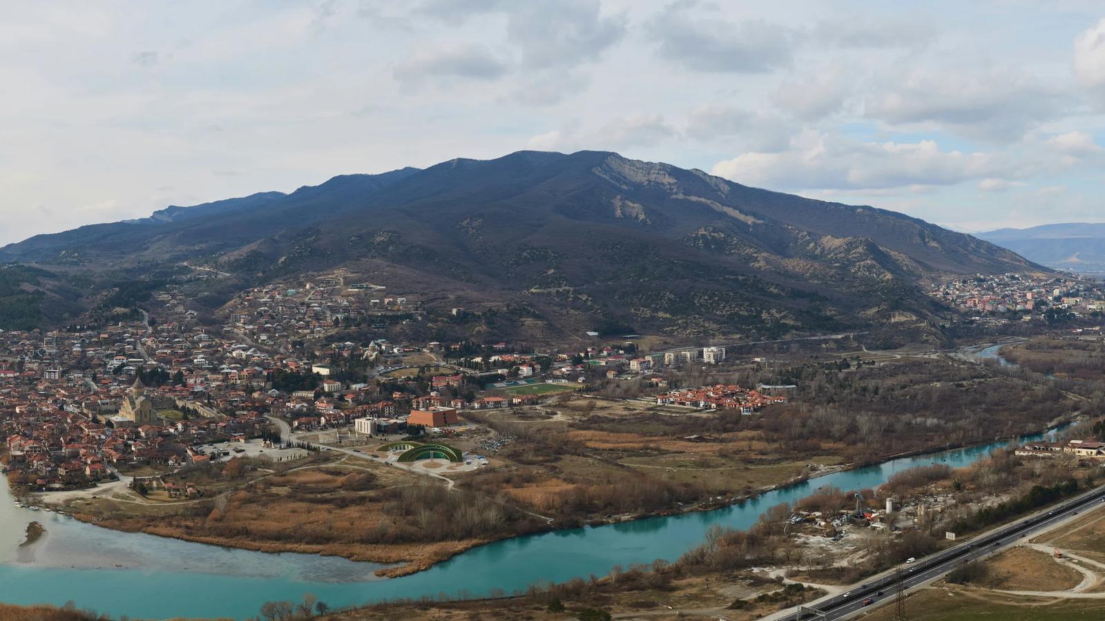 an aerial view of a city and a river