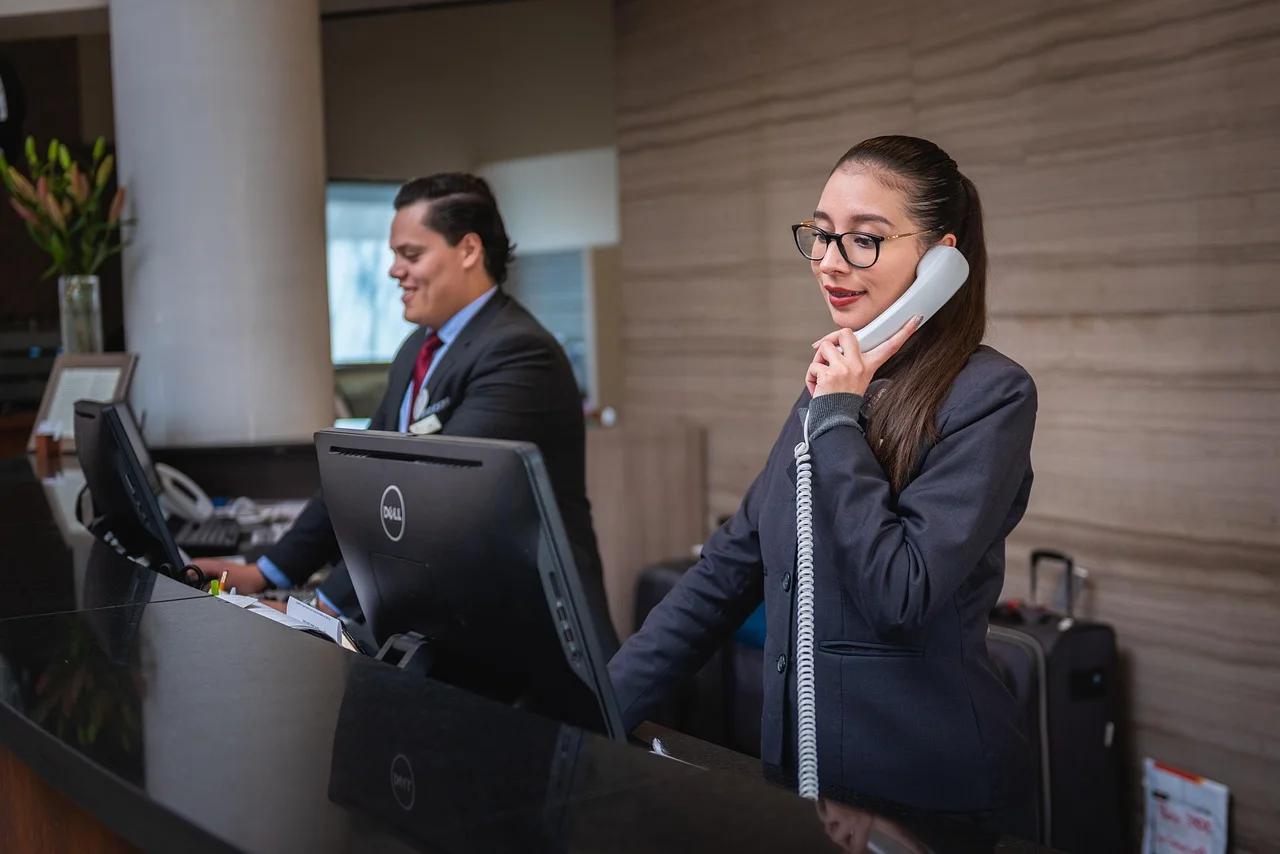 Editor's ChoiceReceptionists, Phone call, Hotel image