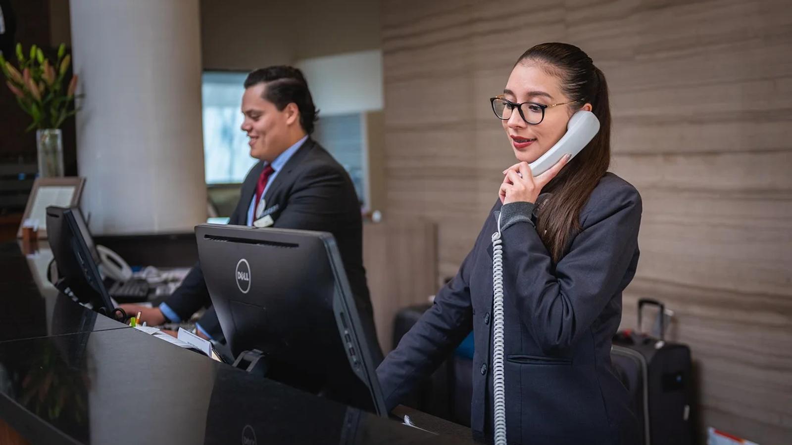 Editor's ChoiceReceptionists, Phone call, Hotel image