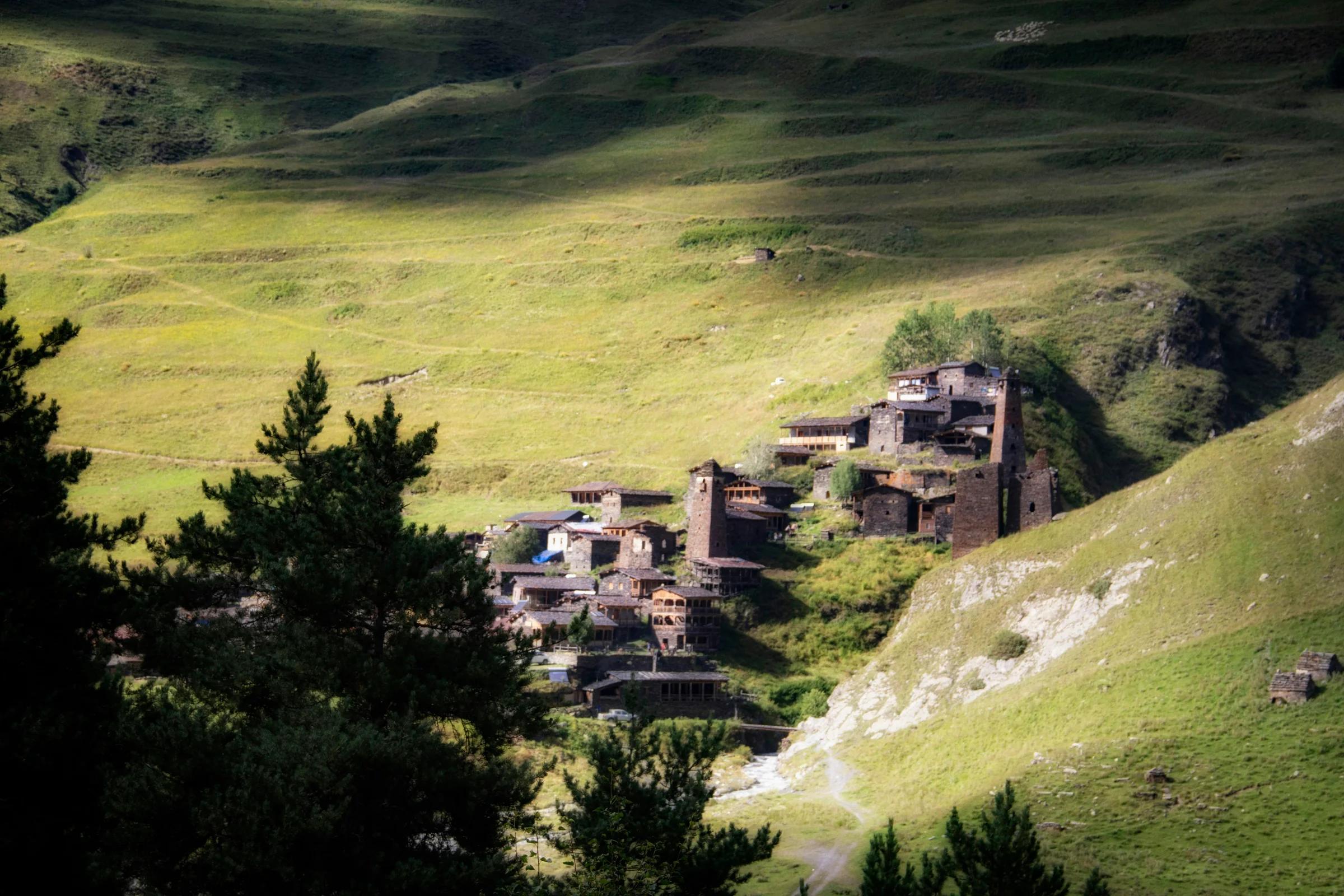 A view of a village in the middle of a valley
