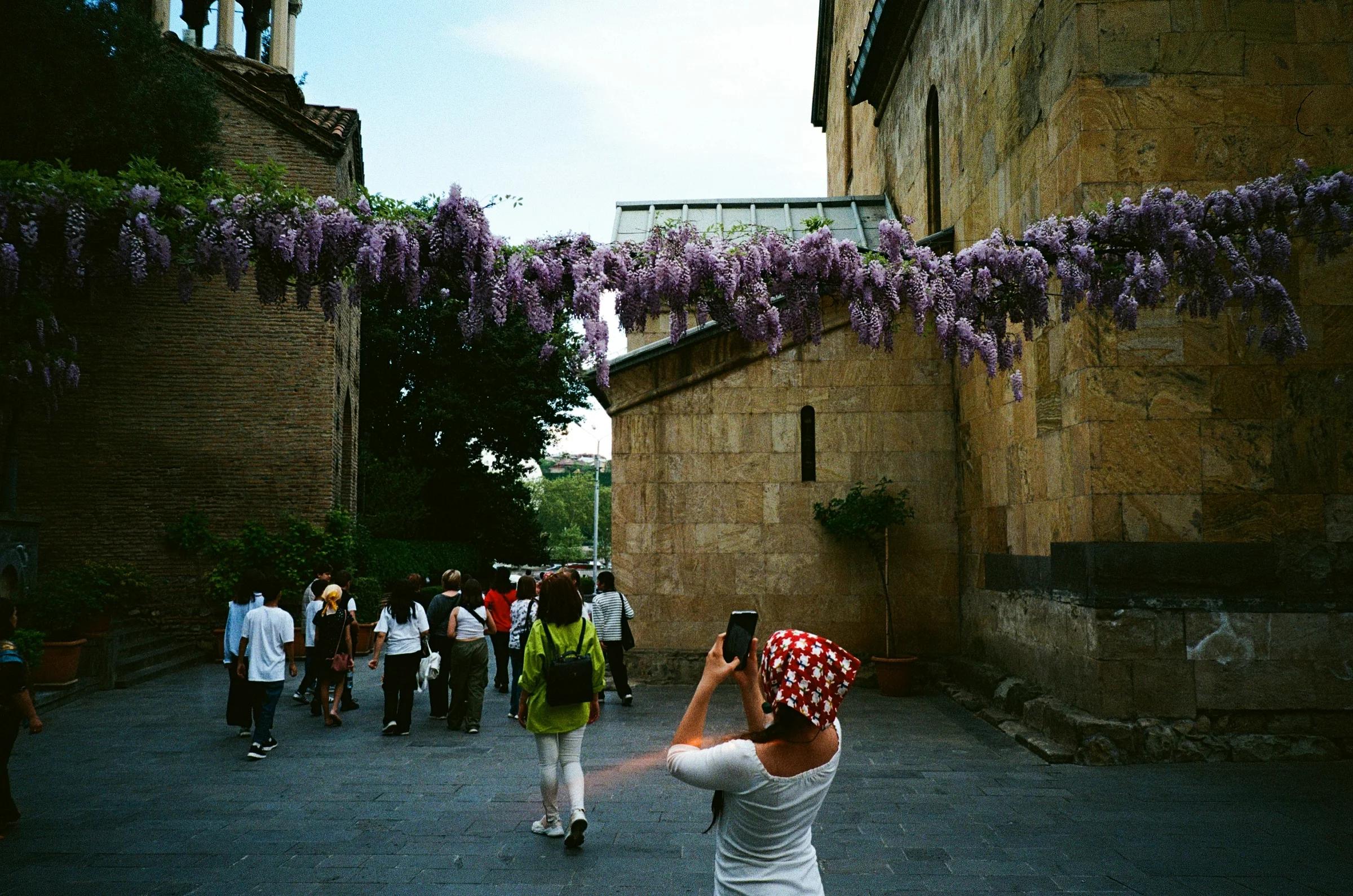 A woman taking a picture of a group of people