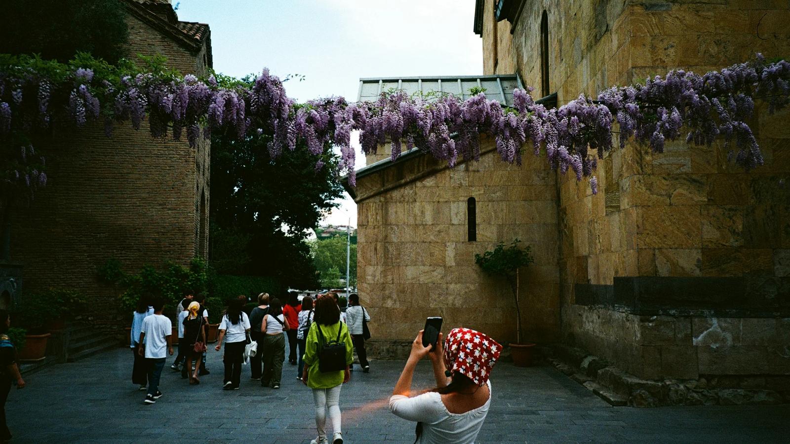 A woman taking a picture of a group of people