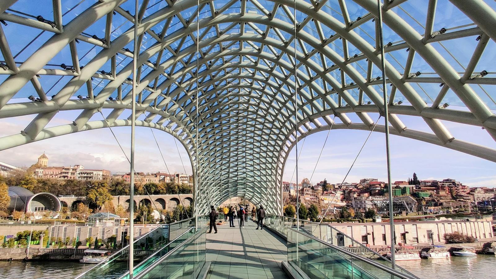a bridge with people walking across it