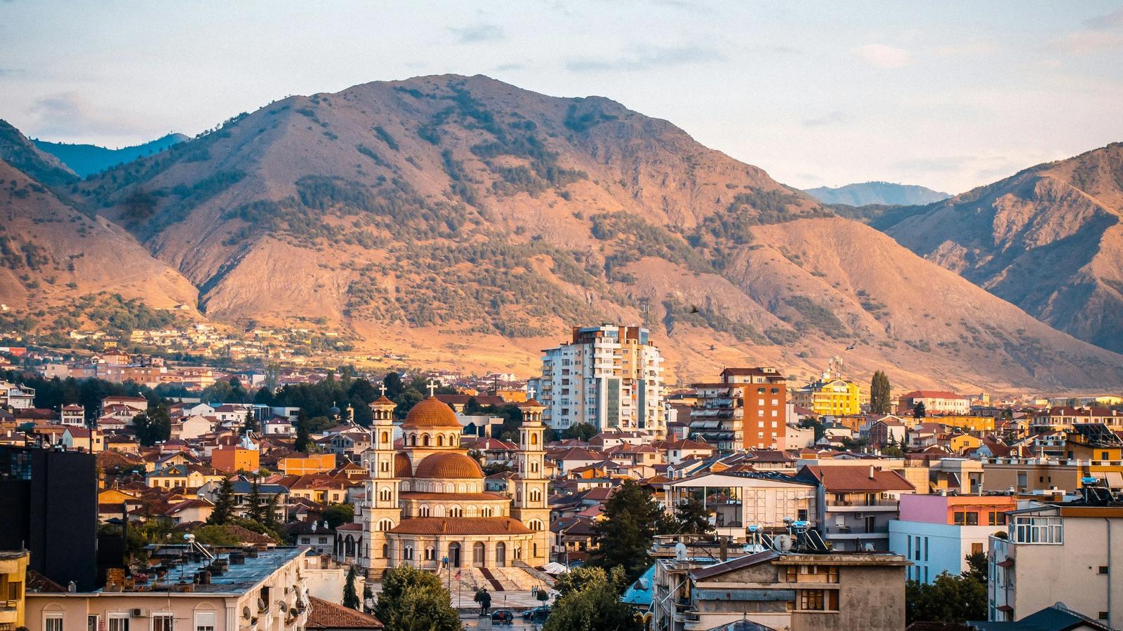 a city with mountains in the background