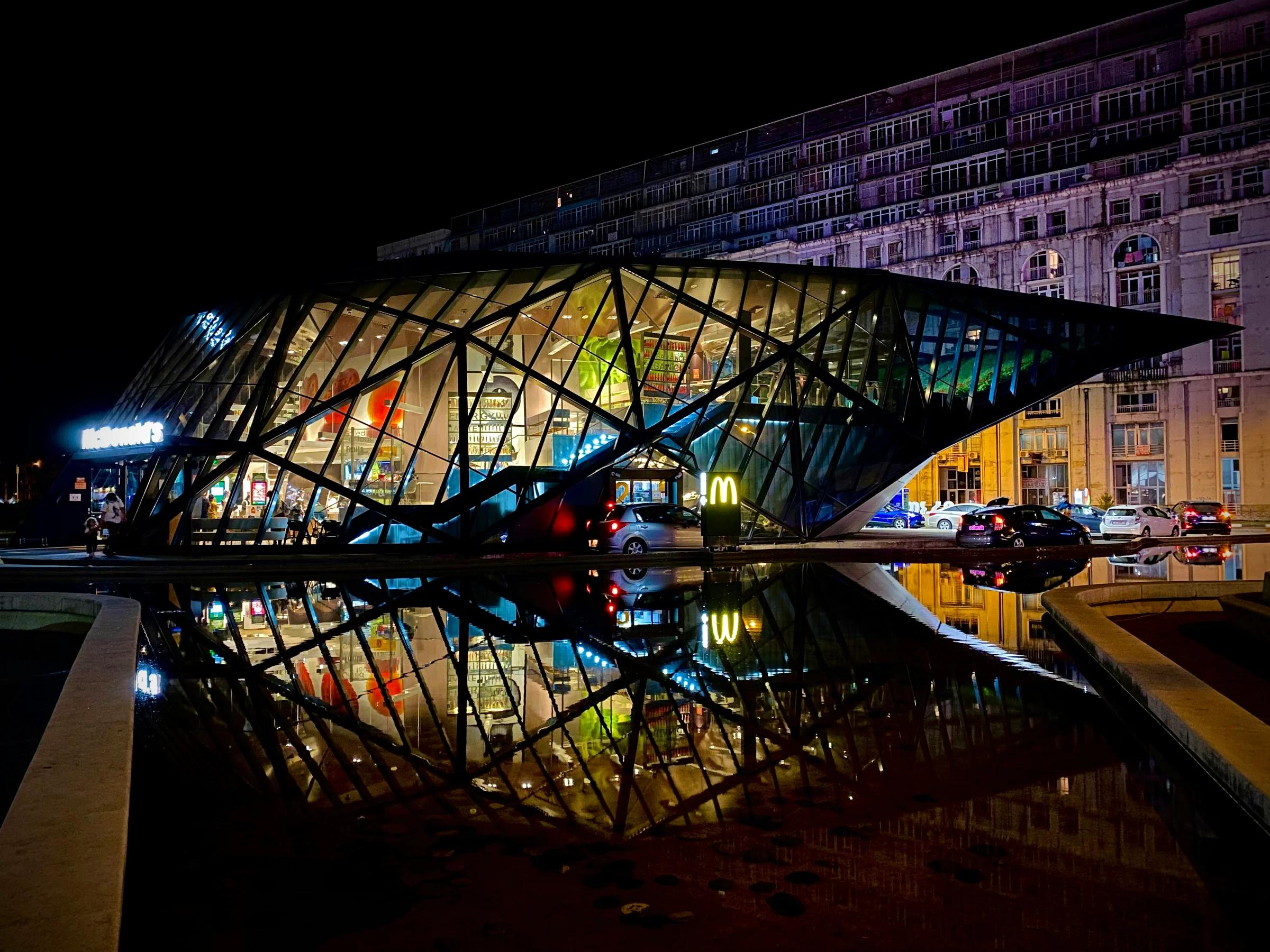 people walking on bridge during night time