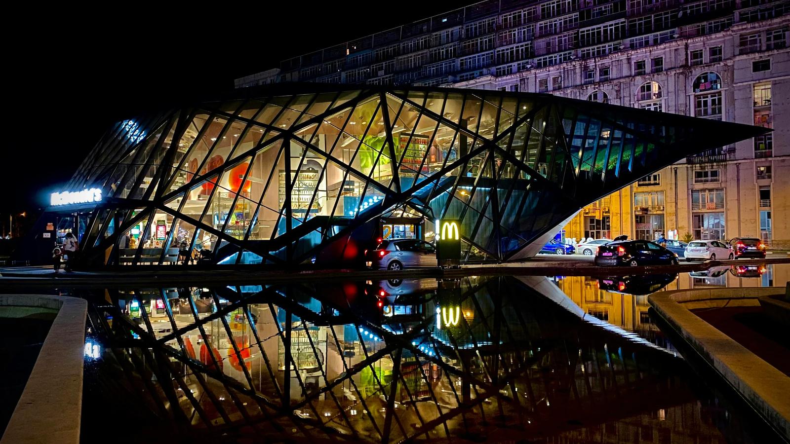 people walking on bridge during night time