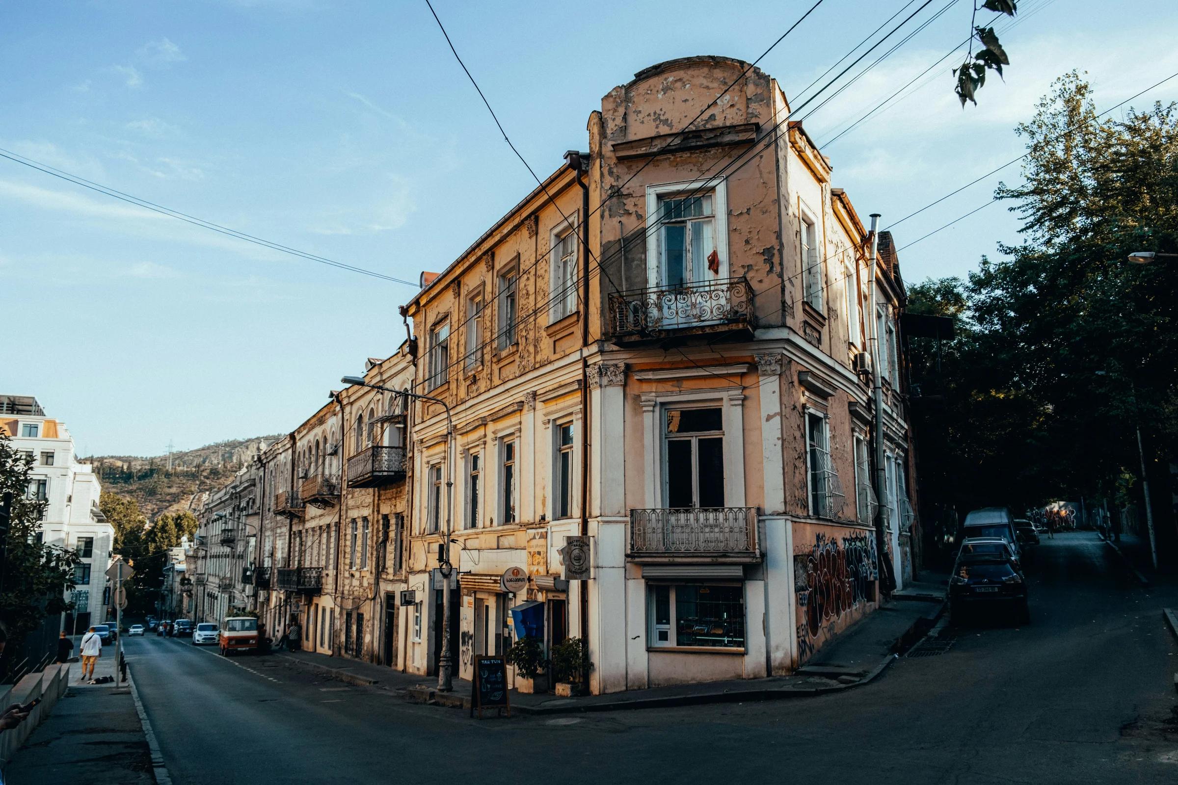 a street with cars and buildings along it