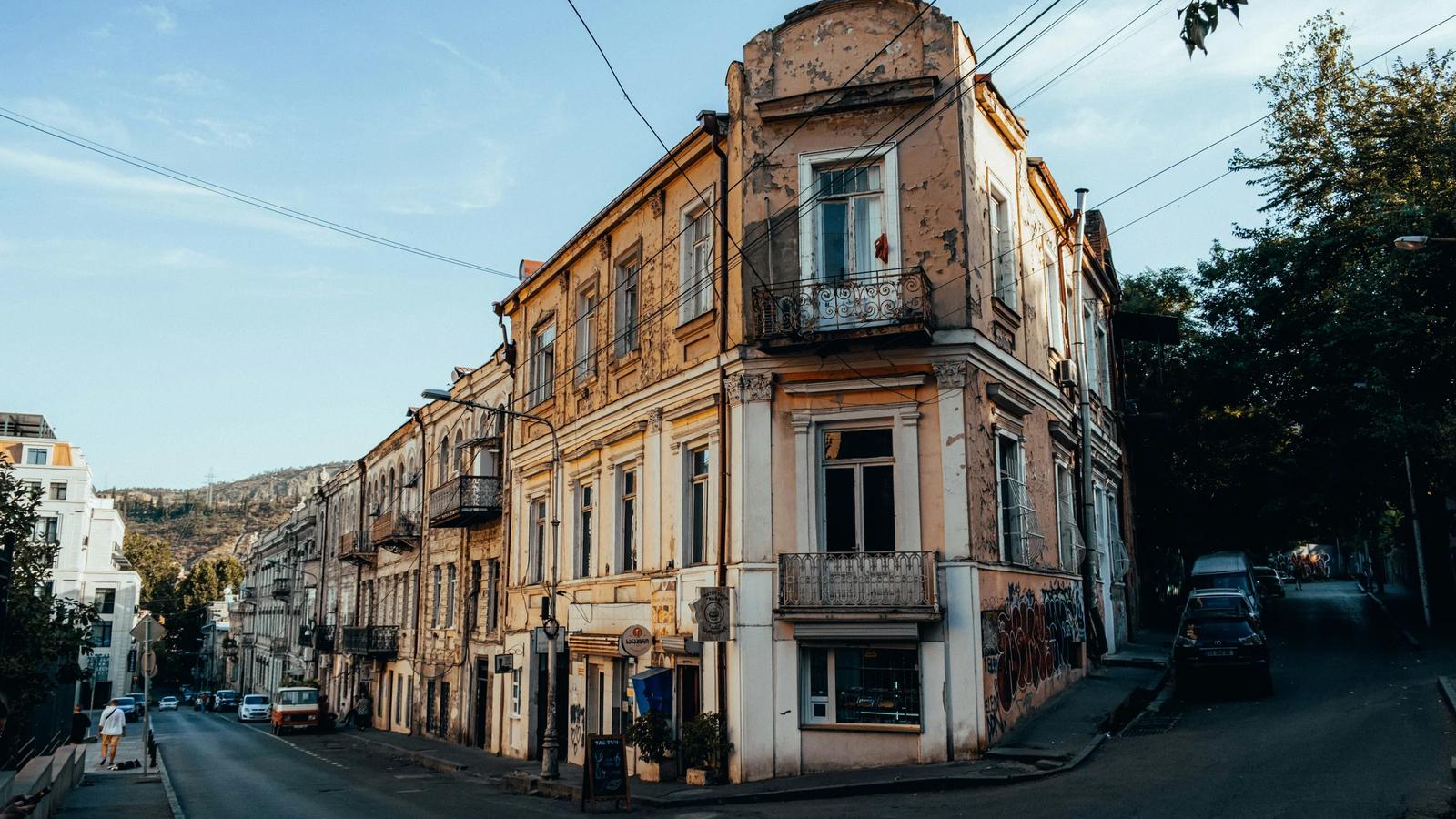 a street with cars and buildings along it
