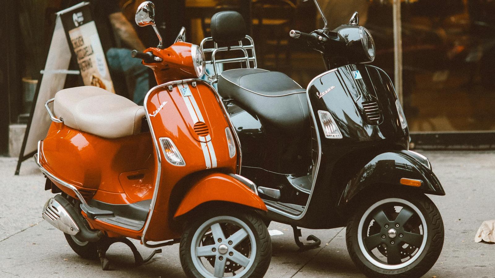 a scooter is parked on the side of the street