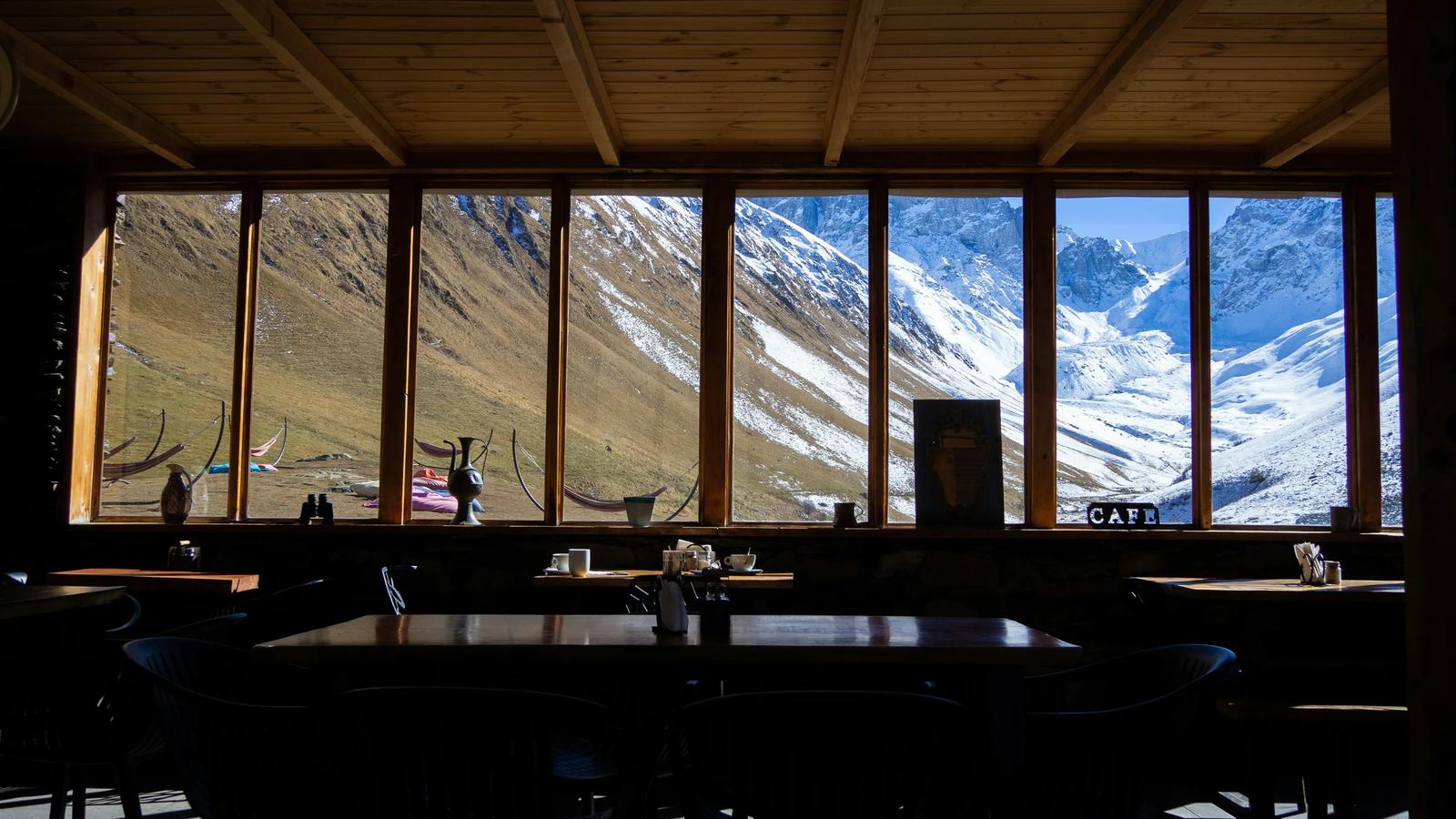 A restaurant with a view of a mountain range