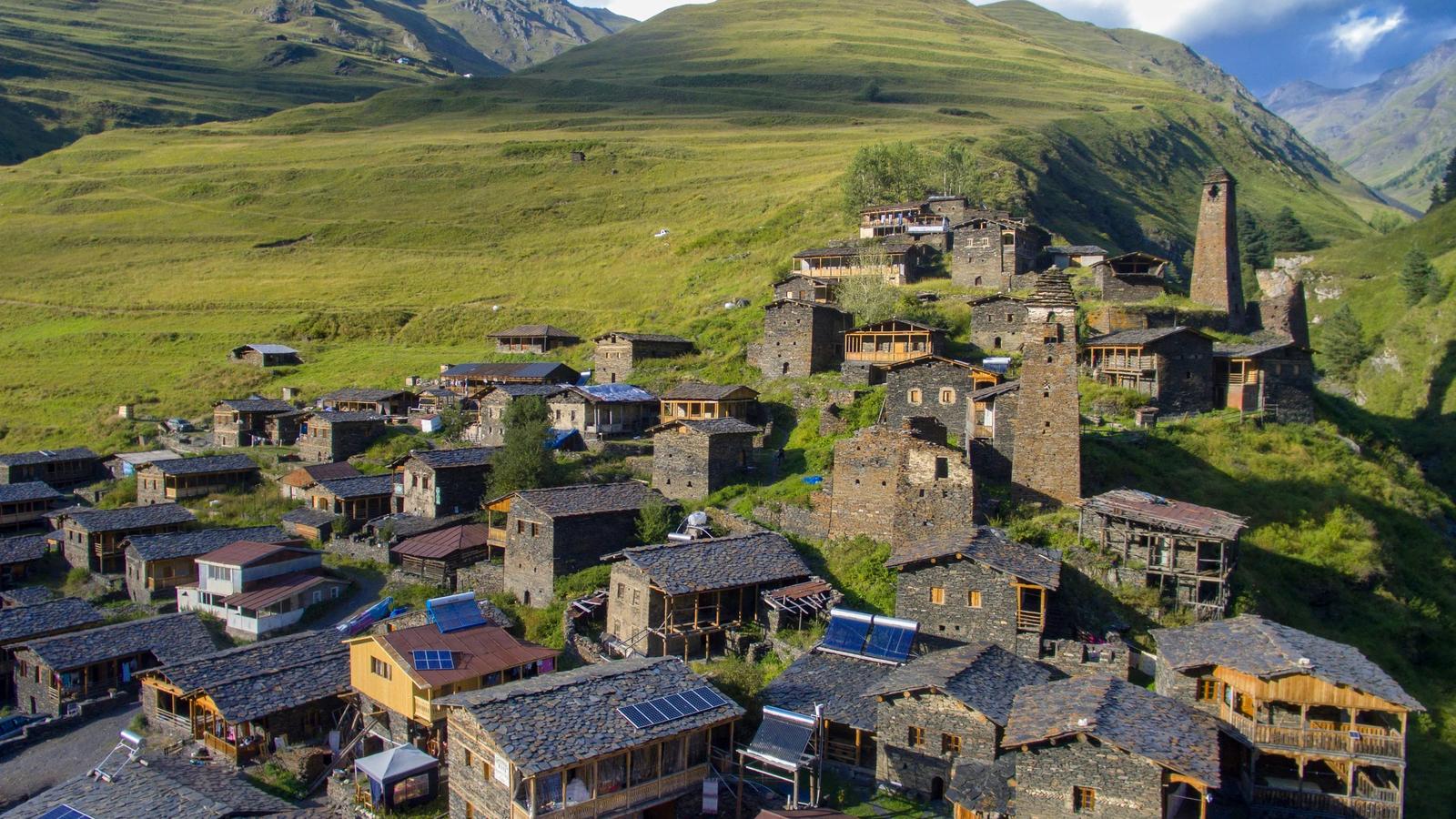 An aerial view of a village in the mountains