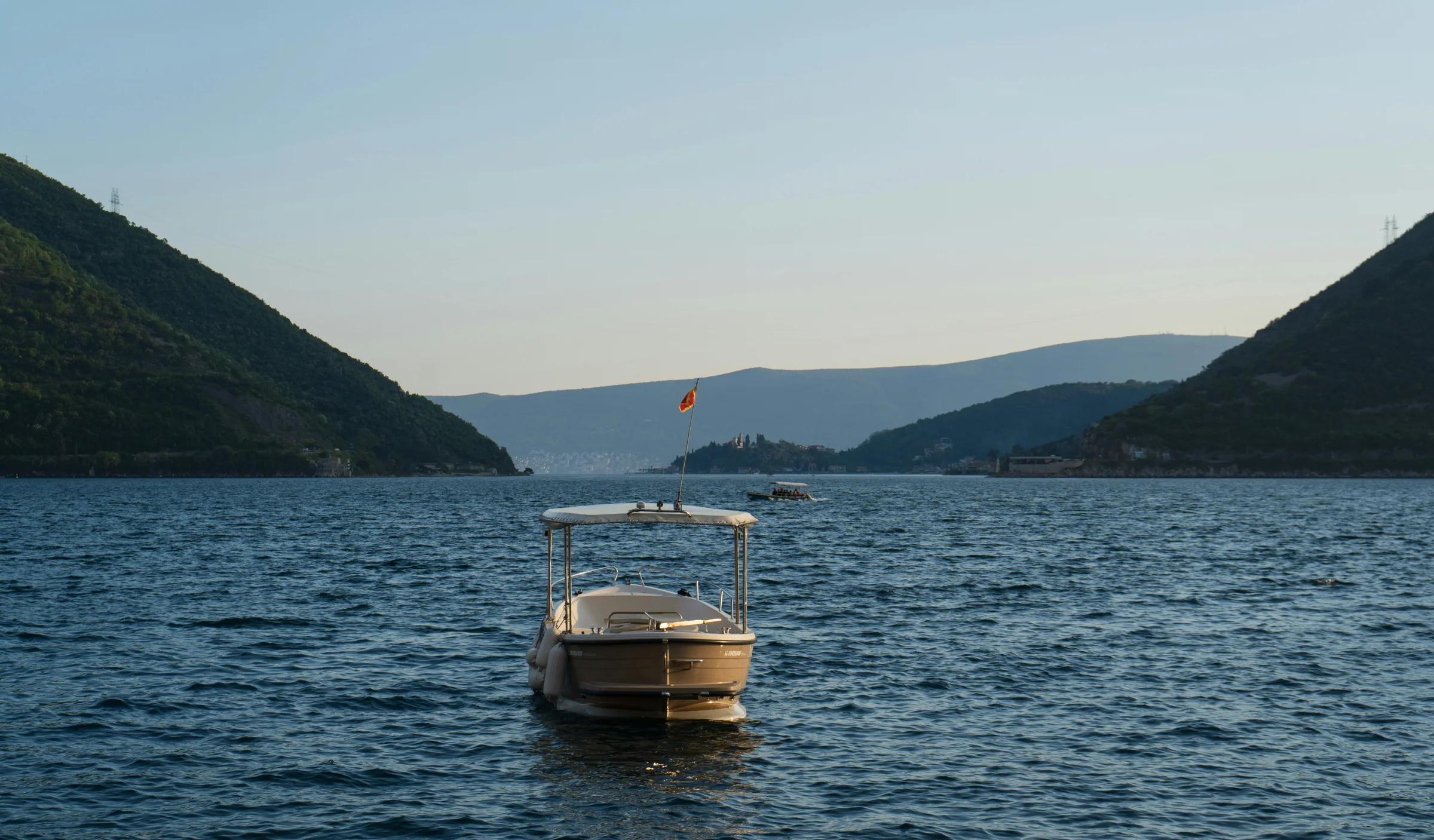 a boat floating on top of a large body of water