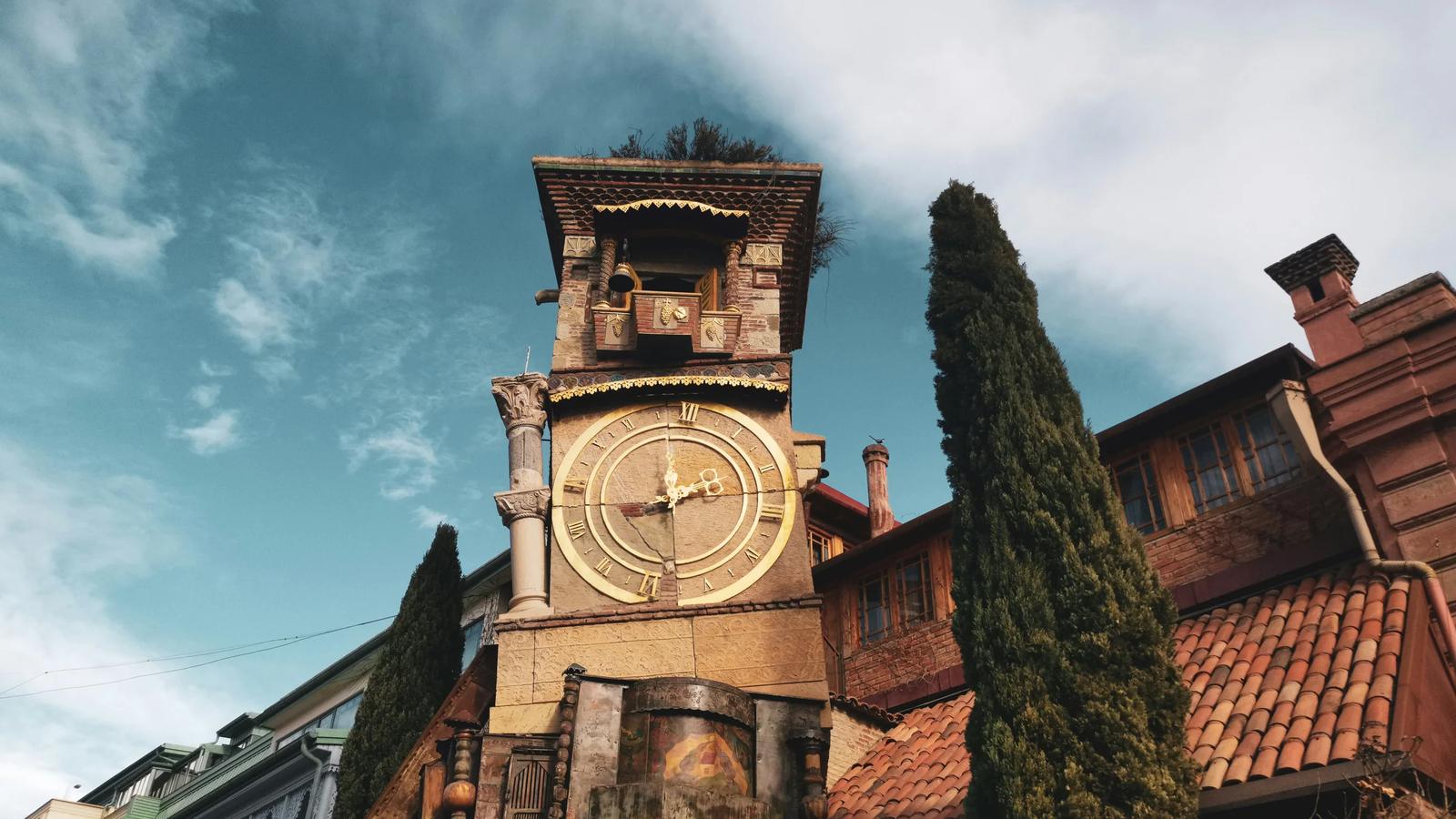 brown concrete building under cloudy sky during daytime
