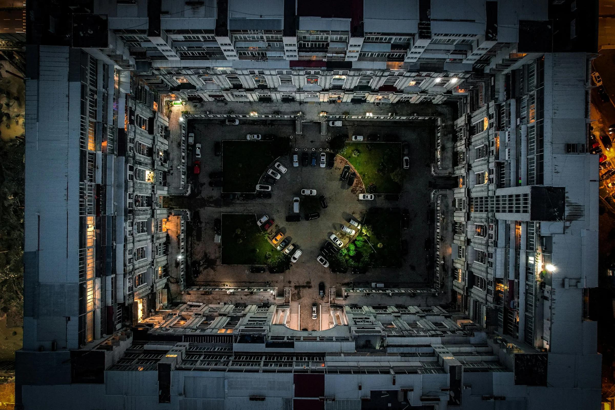 an aerial view of a parking lot at night