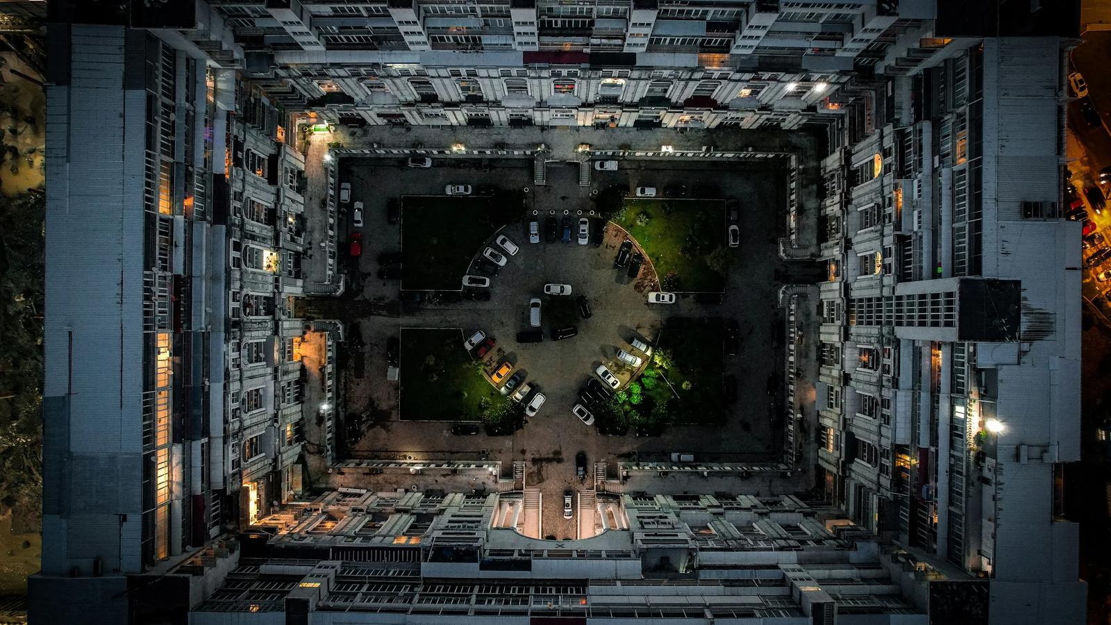 an aerial view of a parking lot at night