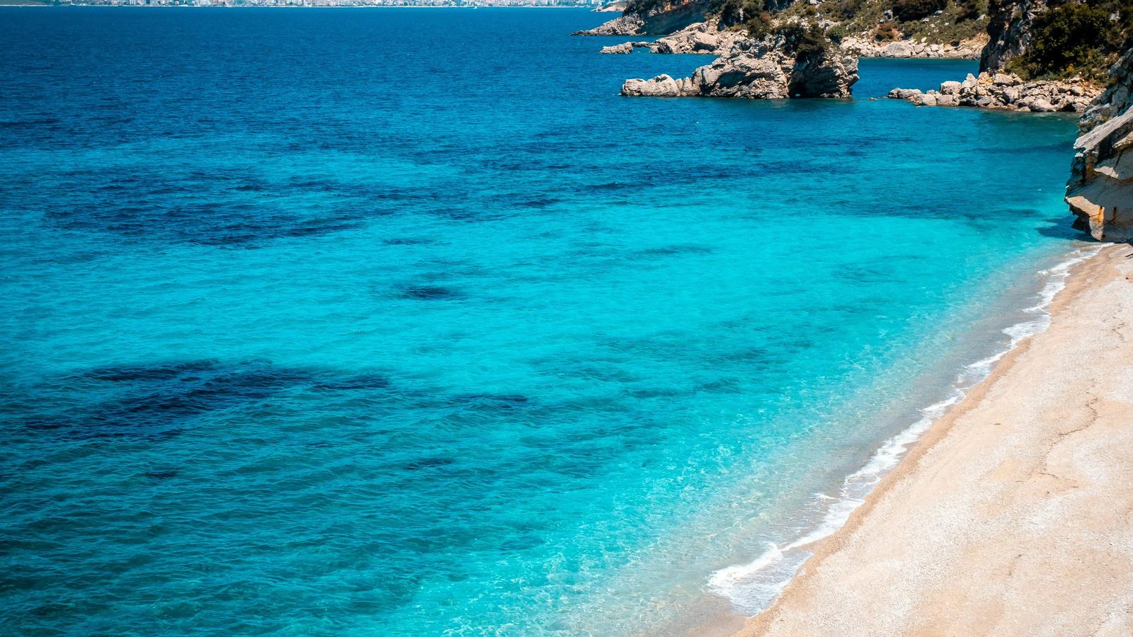 A beautiful beach with crystal clear blue water.