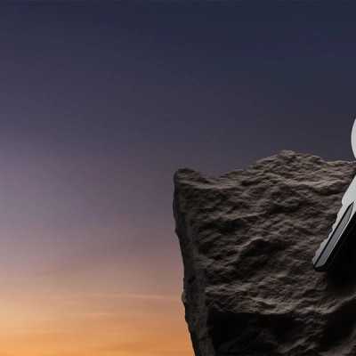 Futuristic digital rendering of a large key bearing the Abloxx logo, resting on a rock against a twilight sky. Large text reads 'Crypto Simplified'.